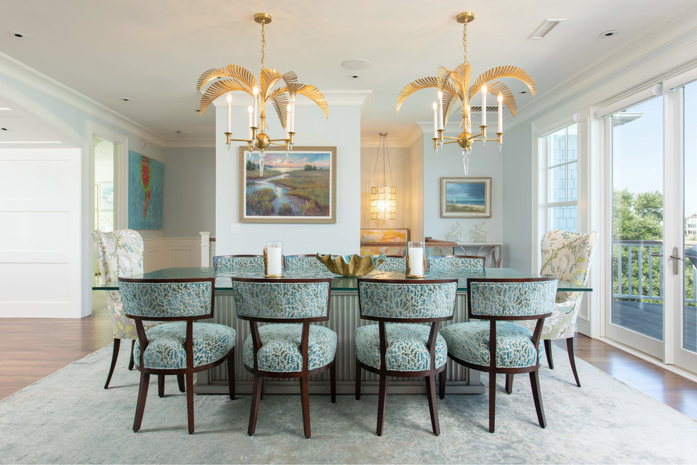 Beach style dining room in Other with blue walls, medium hardwood floors and no fireplace.