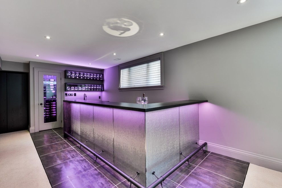 Inspiration for a large modern l-shaped wet bar in Toronto with an undermount sink, flat-panel cabinets, black cabinets, wood benchtops, porcelain floors and black floor.