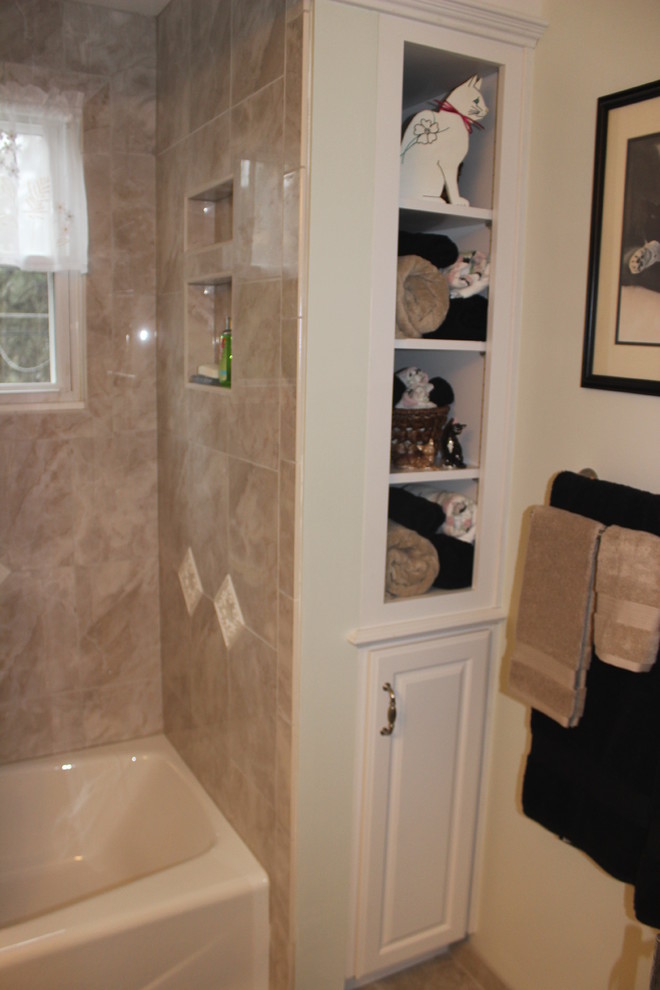 This is an example of a traditional bathroom in Philadelphia with marble benchtops.