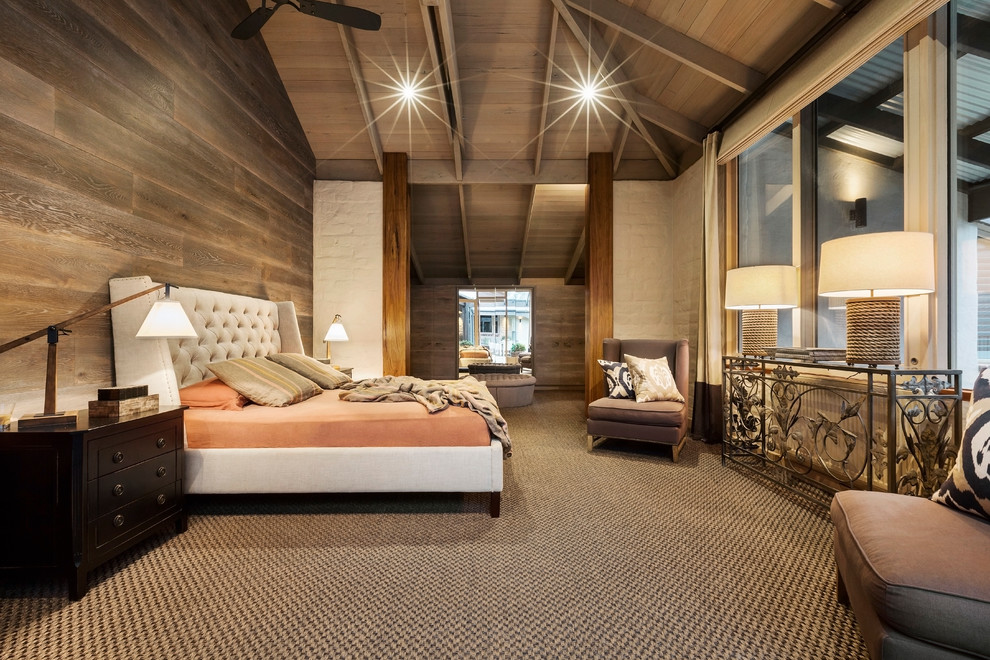 Traditional bedroom in Melbourne with beige walls and carpet.