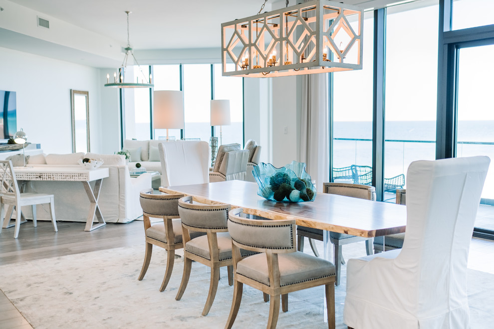 Design ideas for a large beach style open plan dining in Other with white walls, light hardwood floors and grey floor.