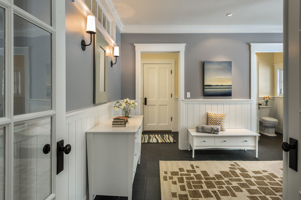 Design ideas for a large traditional foyer in Portland Maine with grey walls, slate floors, a single front door and a medium wood front door.
