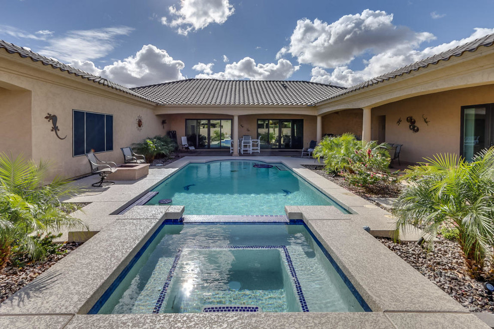 Inspiration for a large transitional backyard concrete and rectangular lap pool fountain remodel in Phoenix