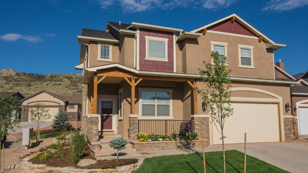 This is an example of a large one-storey stucco brown exterior in Denver.