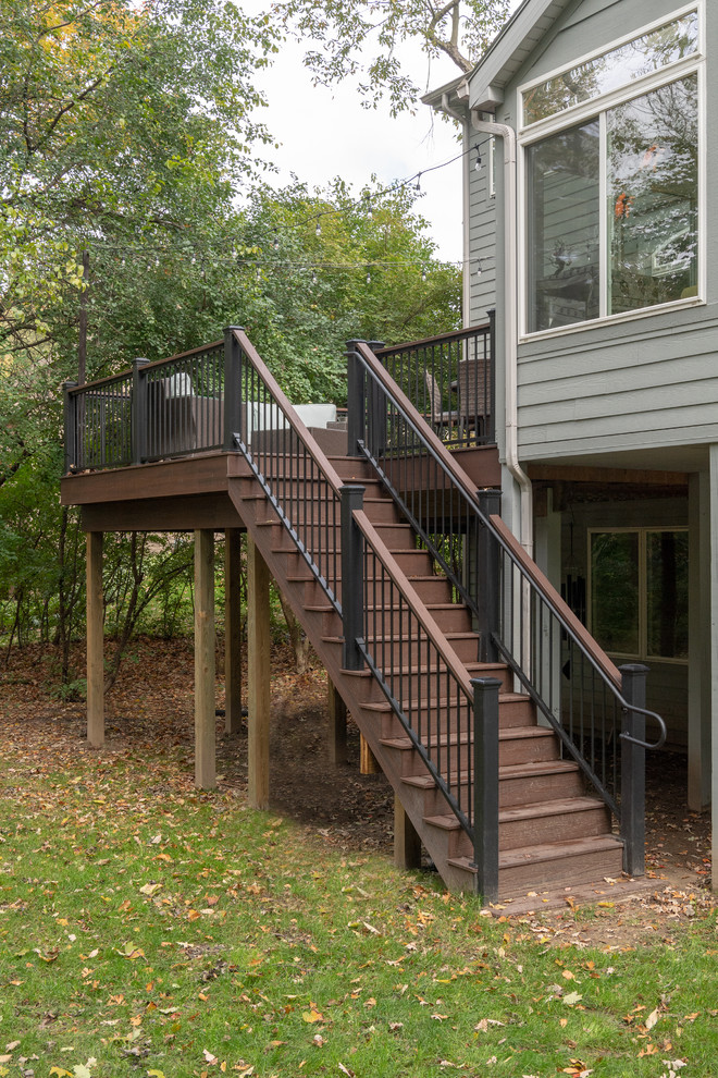Mid-sized transitional backyard deck photo with no cover