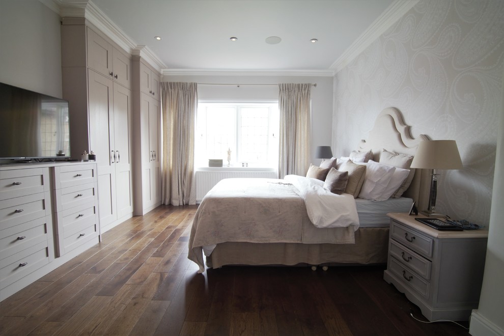 This is an example of a mid-sized country bedroom in London.