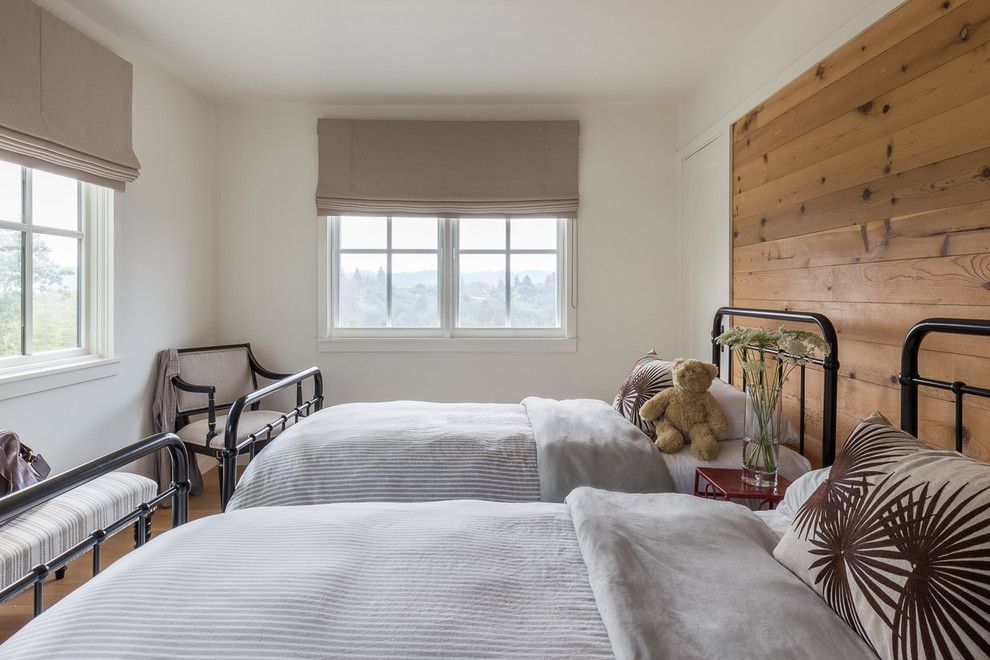 This is an example of a country kids' bedroom for kids 4-10 years old in San Francisco with white walls.