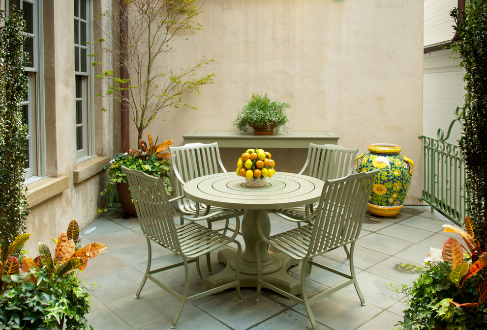 Photo of a contemporary patio in Charleston with tile.