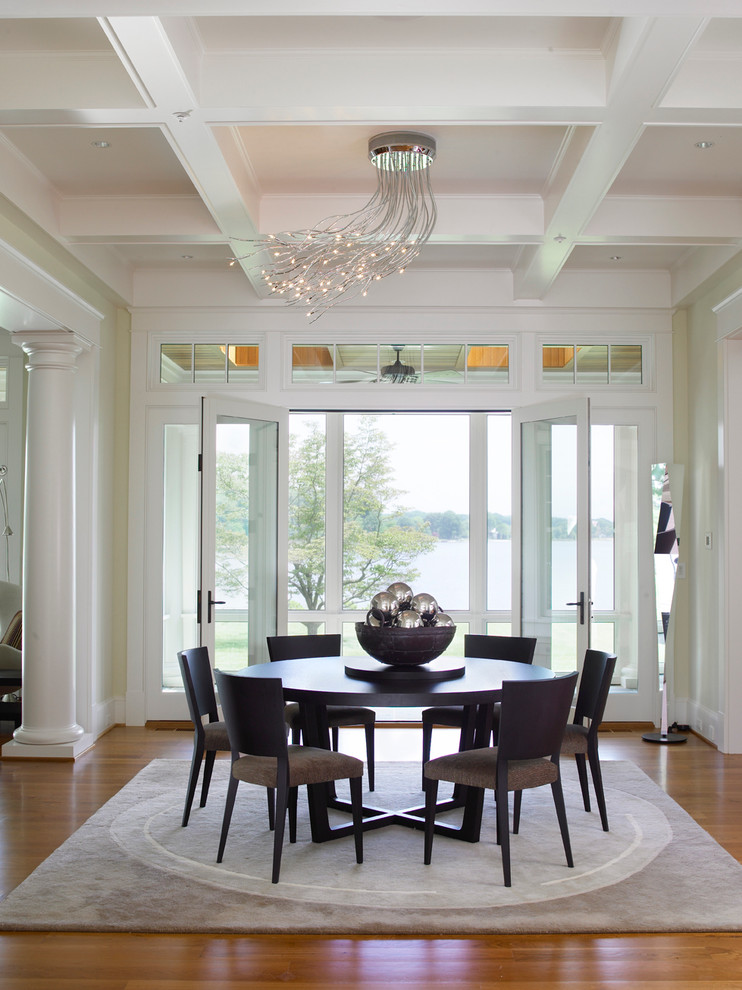 This is an example of a traditional dining room in Baltimore with medium hardwood floors.