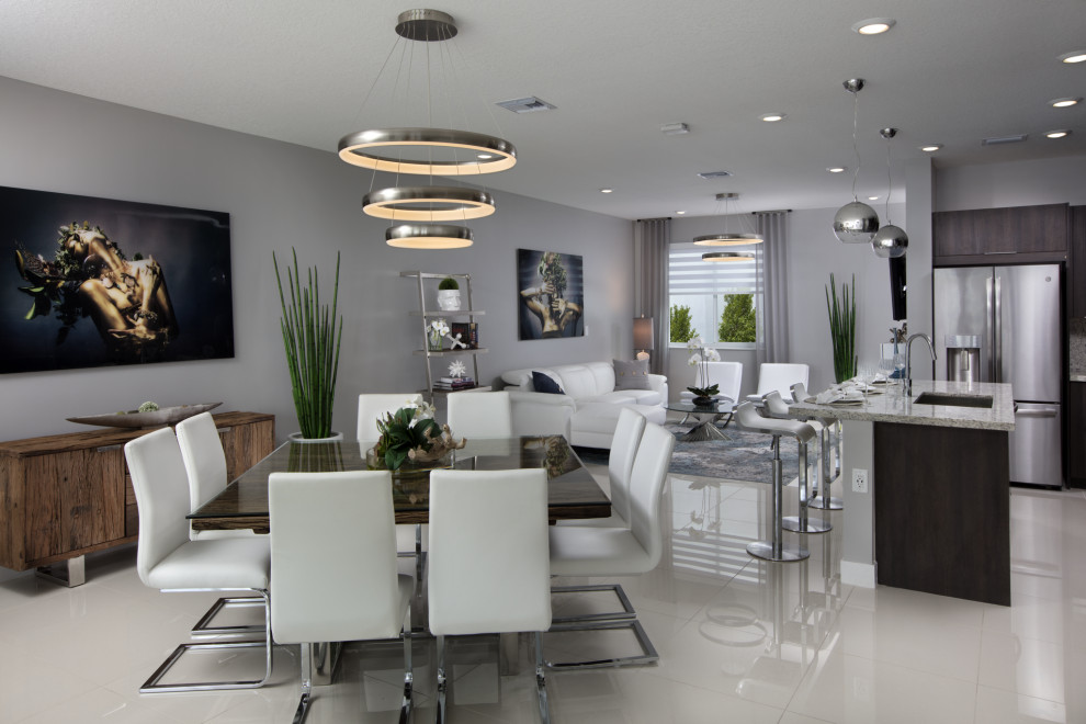 Large contemporary open plan dining in Miami with grey walls, porcelain floors and beige floor.