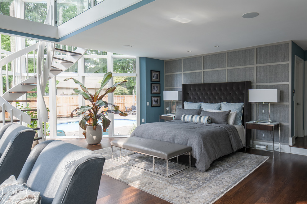 Inspiration for a huge transitional master medium tone wood floor and brown floor bedroom remodel with blue walls, a two-sided fireplace and a tile fireplace
