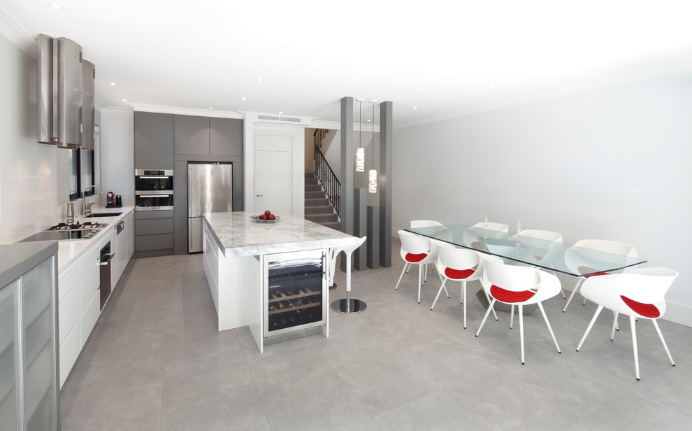 Design ideas for a mid-sized contemporary single-wall eat-in kitchen in Sydney with an undermount sink, flat-panel cabinets, white cabinets, granite benchtops, white splashback, glass sheet splashback, stainless steel appliances and with island.
