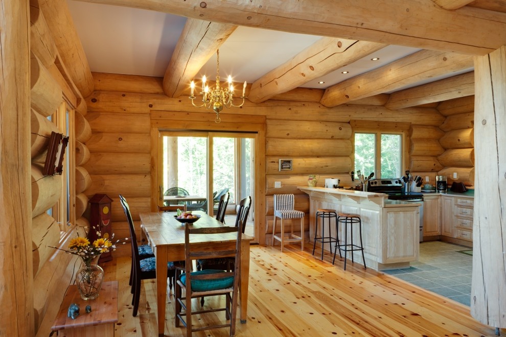 Mid-sized country kitchen/dining combo in Montreal with light hardwood floors.