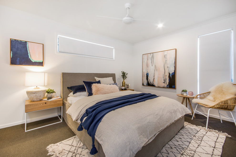 Contemporary master bedroom in Sunshine Coast with white walls, carpet and beige floor.
