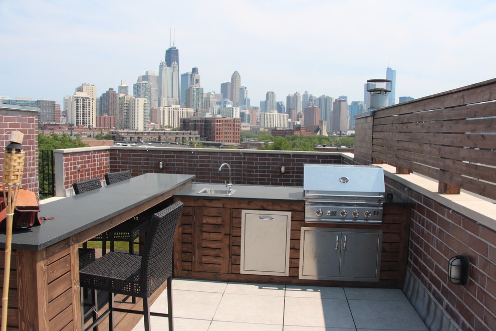Inspiration for a large contemporary rooftop deck in Chicago with an outdoor kitchen and a pergola.