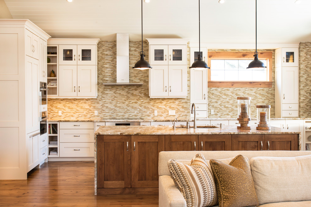 Photo of a traditional kitchen in Calgary with shaker cabinets, white cabinets, brown splashback and matchstick tile splashback.
