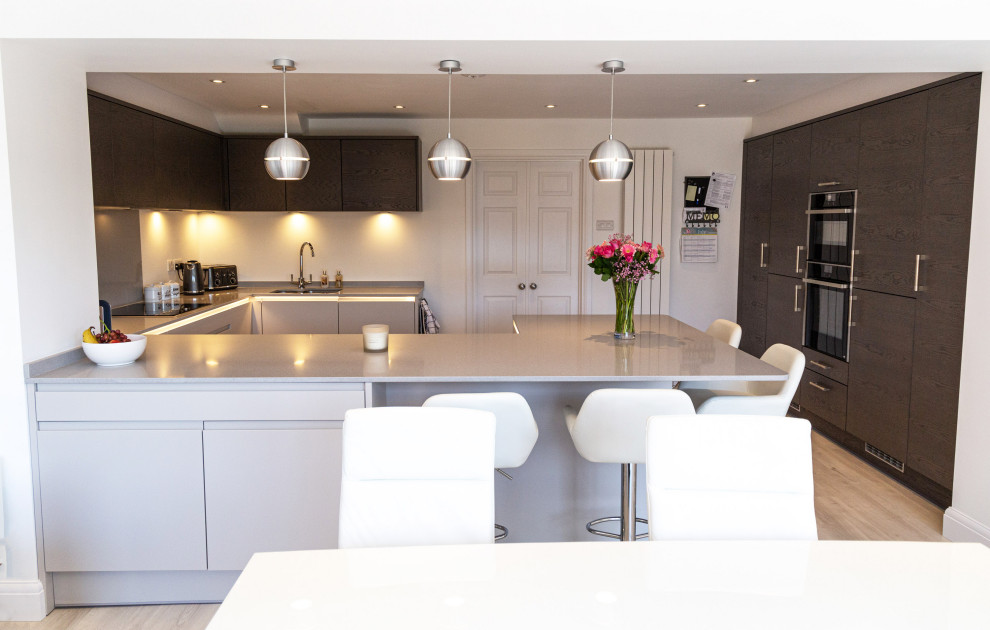 U shaped Kitchen with open plan family area and folding doors ...