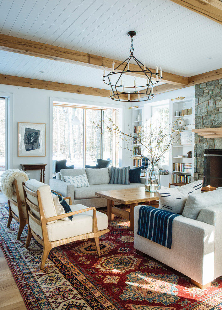 Large transitional open concept light wood floor living room photo in Portland Maine with white walls, a standard fireplace, a stone fireplace and no tv