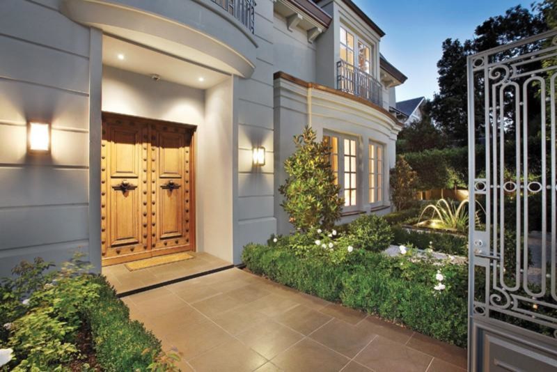 Large traditional front door in Melbourne with ceramic floors, a double front door, a medium wood front door, grey walls and grey floor.