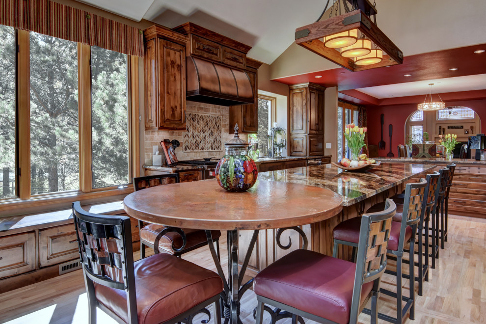 Example of a mountain style home design design in Denver