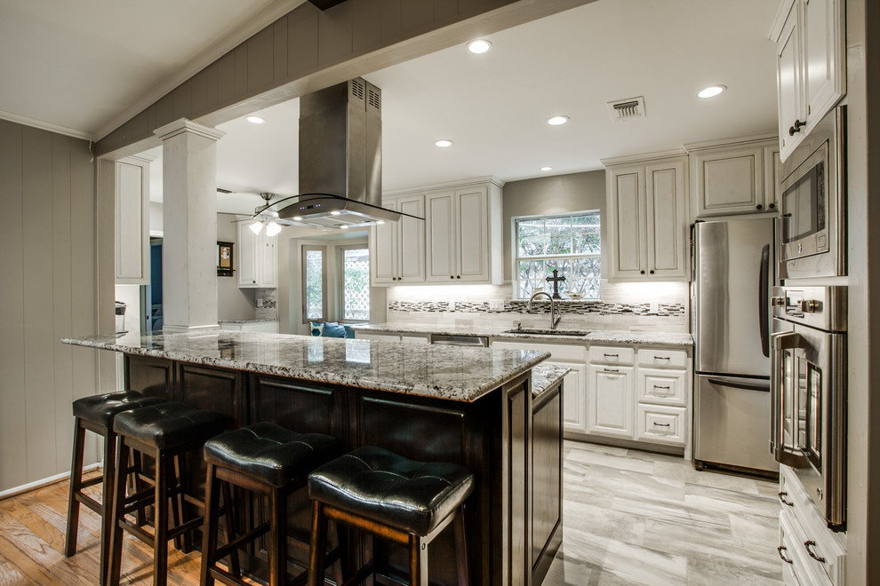 Inspiration for a transitional kitchen in Dallas with granite benchtops, multi-coloured splashback, stainless steel appliances, porcelain floors, with island, raised-panel cabinets and light wood cabinets.