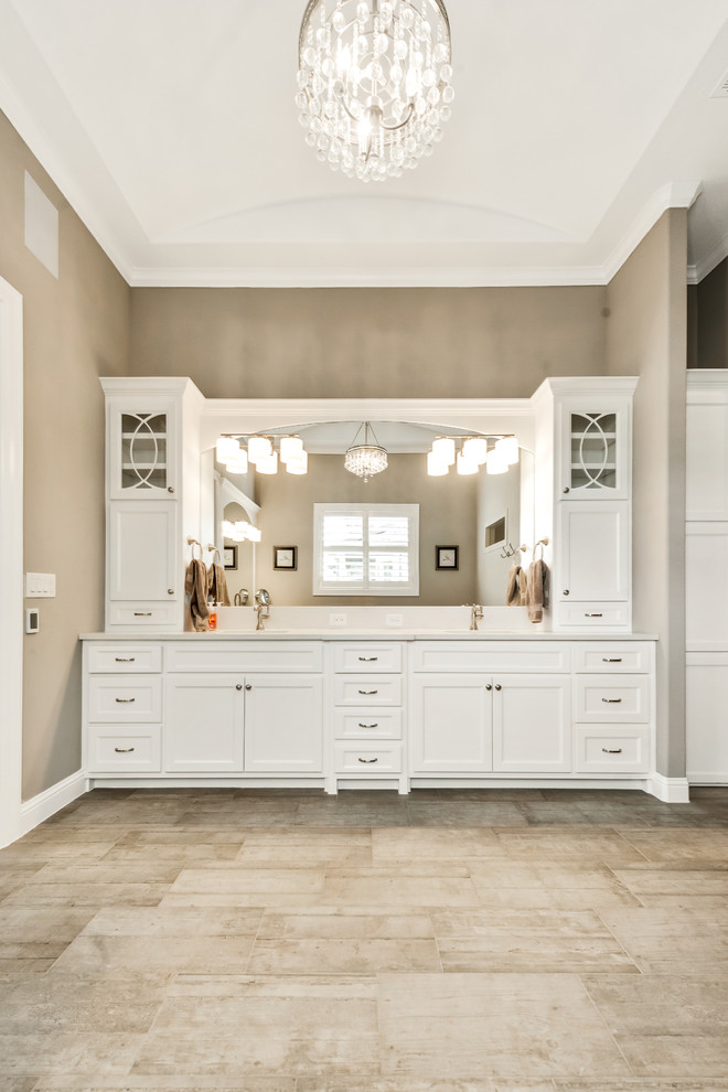 Design ideas for a small transitional 3/4 bathroom in Dallas with shaker cabinets, dark wood cabinets, brown tile, glass tile, beige walls, dark hardwood floors, a vessel sink and engineered quartz benchtops.