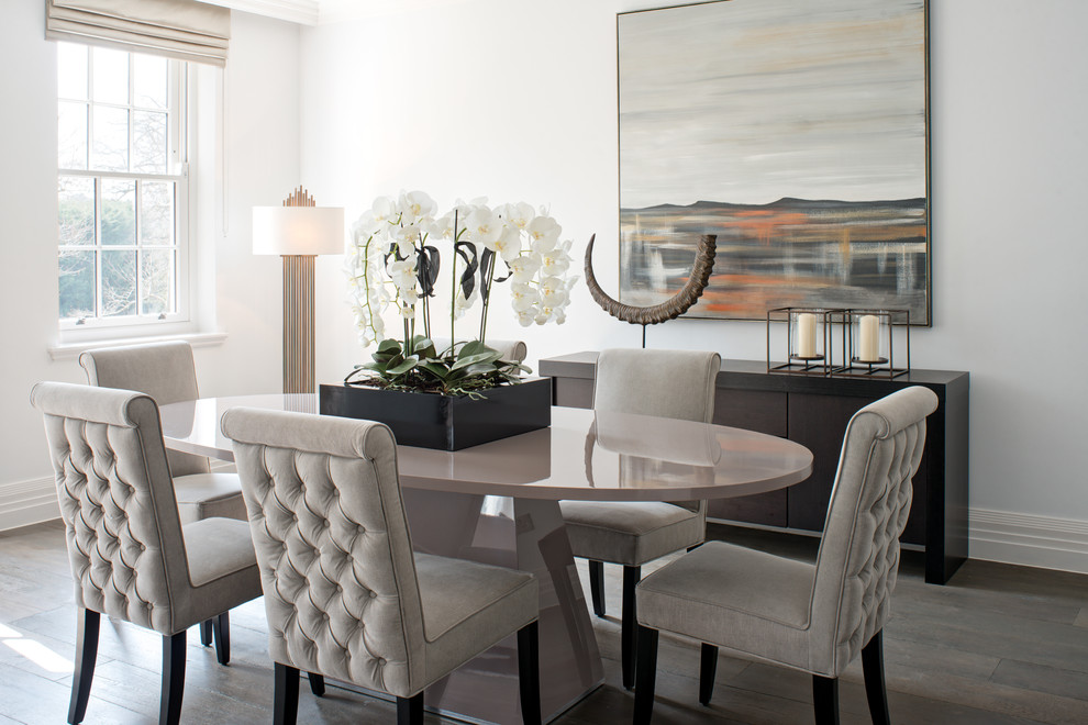 Transitional dining room in Surrey with white walls and dark hardwood floors.