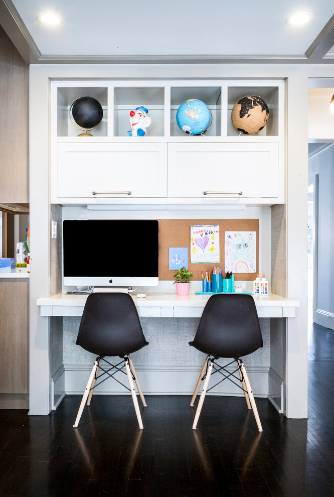 Inspiration for a small transitional gender-neutral kids' study room for kids 4-10 years old in New York with dark hardwood floors and grey walls.