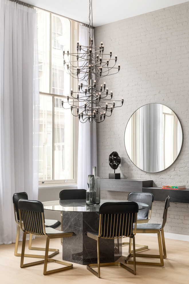 Inspiration for a contemporary dining room in New York with grey walls, light hardwood floors and beige floor.