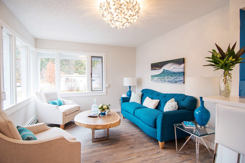 This is an example of a small beach style open concept living room in Vancouver with grey walls and vinyl floors.