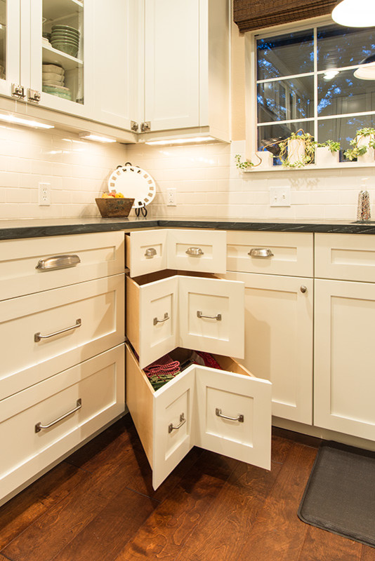 Inspiration for a transitional kitchen remodel in Austin with shaker cabinets, white cabinets and white backsplash