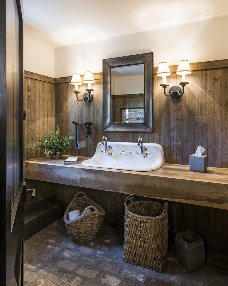 Large country bathroom in Louisville with open cabinets, medium wood cabinets, brick floors, a trough sink, wood benchtops, brown walls and brown benchtops.