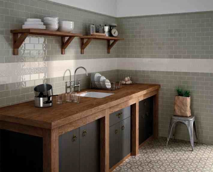 Mid-sized country single-wall separate kitchen in Portland Maine with an undermount sink, flat-panel cabinets, dark wood cabinets, wood benchtops, grey splashback, subway tile splashback, cement tiles, no island and multi-coloured floor.