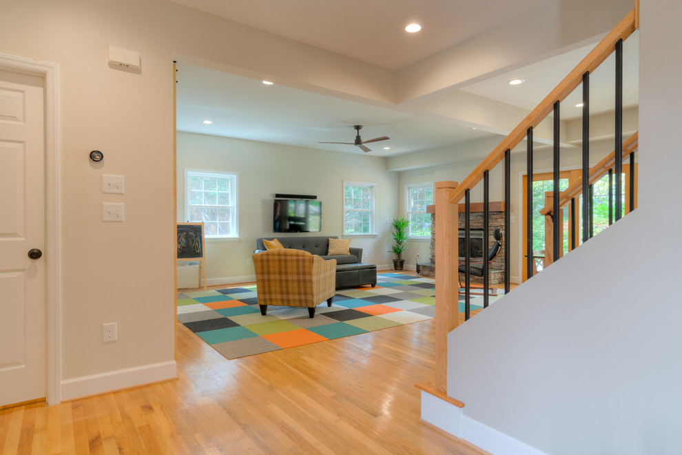Mid-sized transitional light wood floor foyer photo