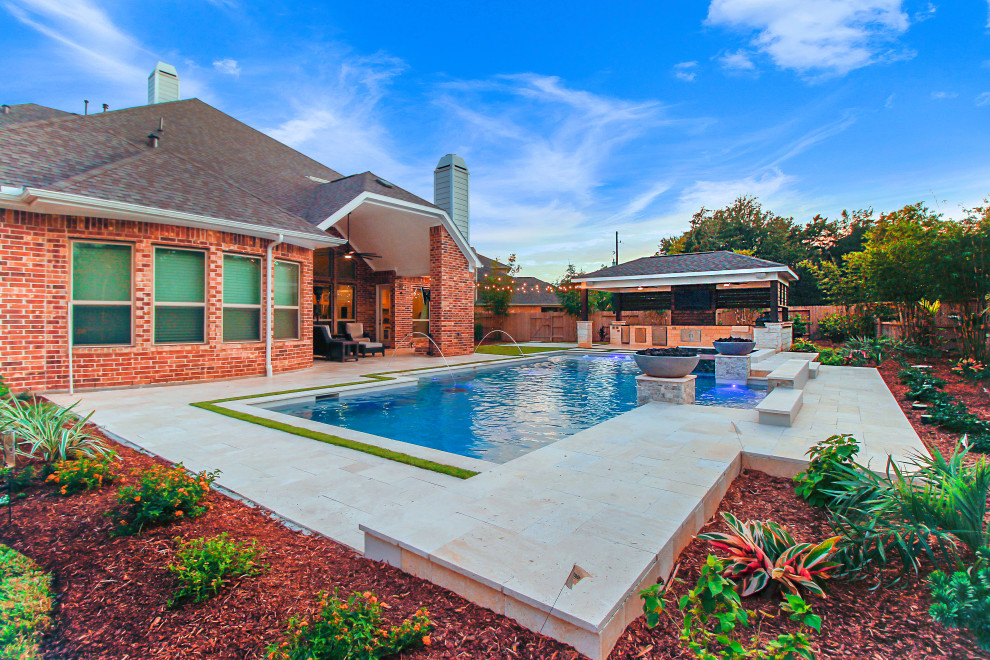 Design ideas for a large modern backyard custom-shaped pool in Houston with natural stone pavers.