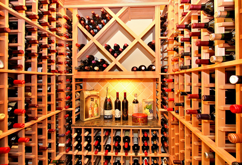 Design ideas for a small traditional wine cellar in San Diego with marble floors and storage racks.