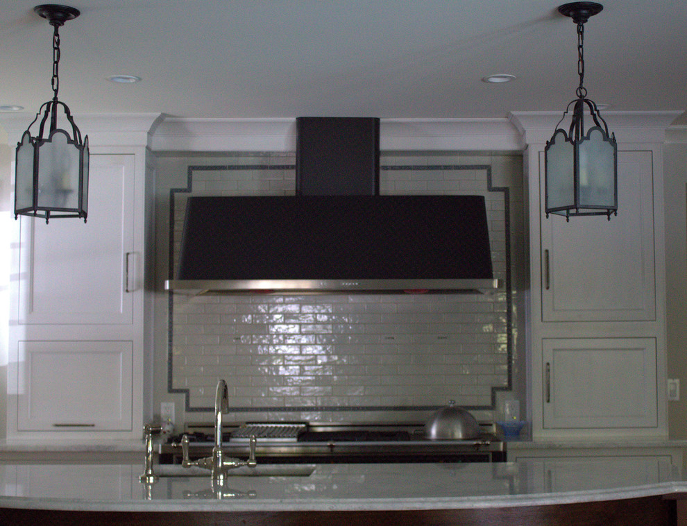 Large transitional u-shaped medium tone wood floor open concept kitchen photo in New York with a double-bowl sink, beaded inset cabinets, gray cabinets, quartzite countertops, blue backsplash, subway tile backsplash, black appliances and an island