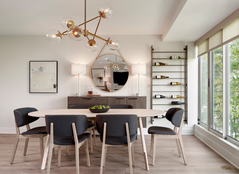 Design ideas for a mid-sized contemporary open plan dining in Chicago with white walls, light hardwood floors and brown floor.