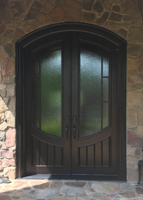 Inspiration pour une grande porte d'entrée craftsman avec une porte double et une porte marron.