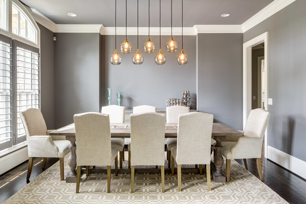 Transitional separate dining room in Atlanta with grey walls and dark hardwood floors.