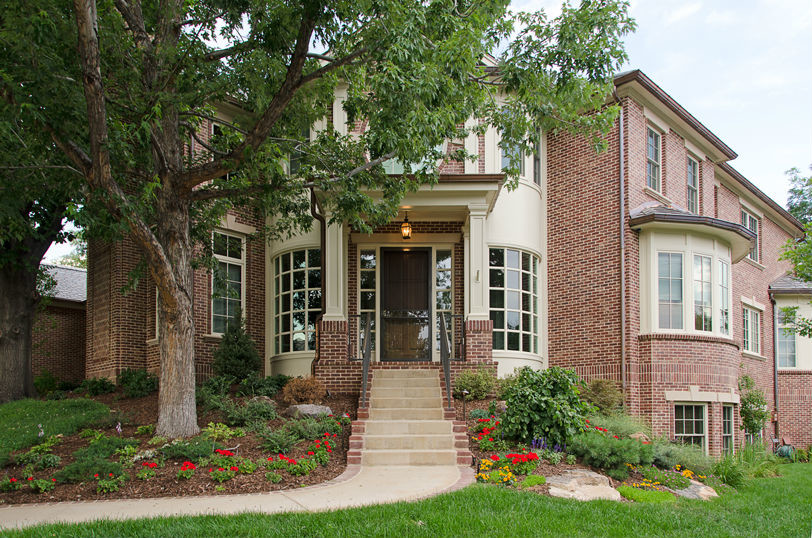 Inspiration for a large timeless three-story brick exterior home remodel in Denver