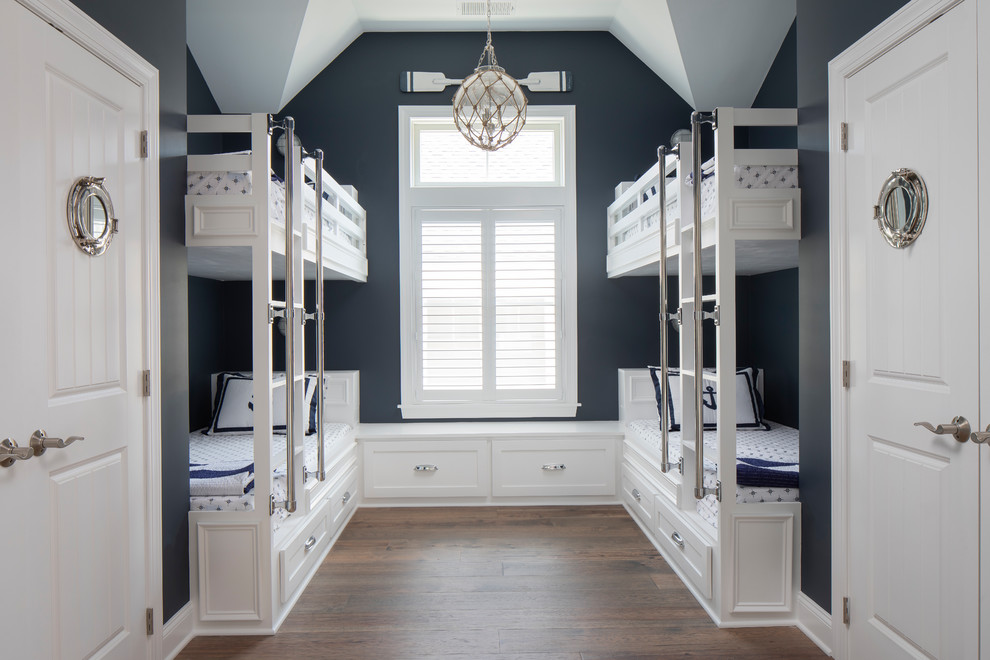 Beach Haven Coastal Cottage - Nautical style bunk room with double closets! The custom bunk built-ins offer storage below while double flanking closets offer plenty of room for everyone!

Photography by John Martinelli