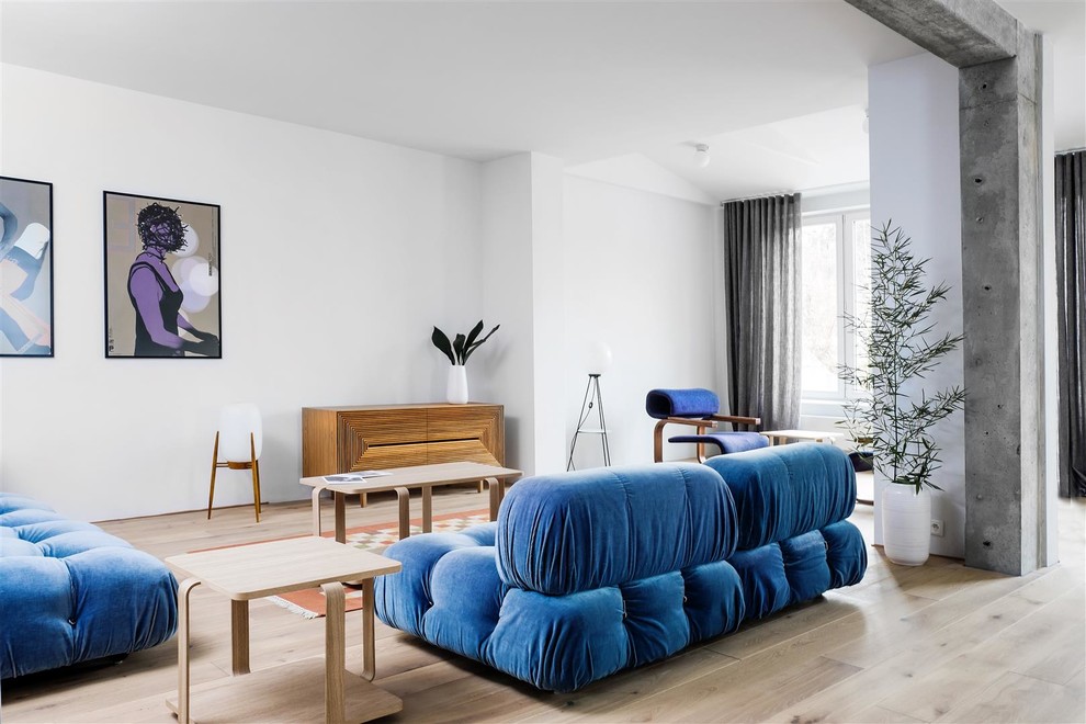 Inspiration for a mid-sized midcentury formal open concept living room in Berlin with white walls, light hardwood floors, no fireplace and no tv.