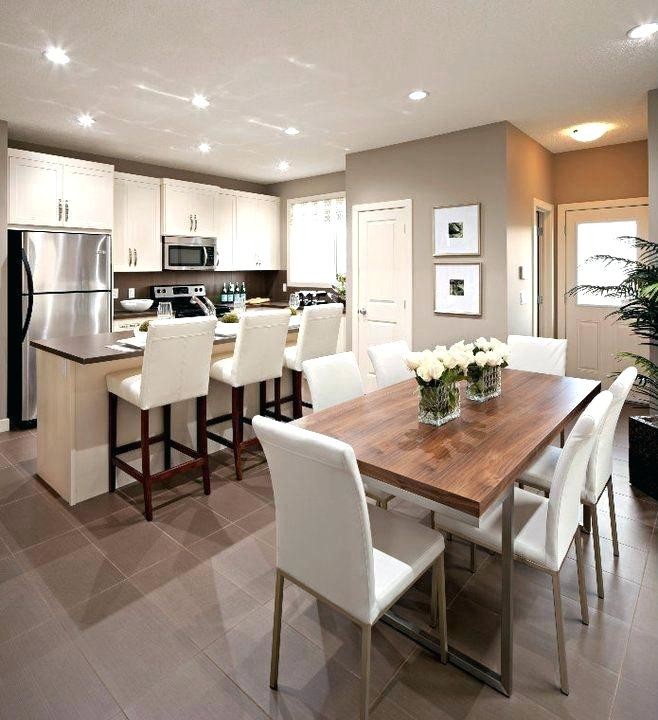 Inspiration for a mid-sized transitional u-shaped eat-in kitchen in Dallas with an undermount sink, recessed-panel cabinets, white cabinets, granite benchtops, grey splashback, ceramic splashback, stainless steel appliances, ceramic floors, with island, grey floor and multi-coloured benchtop.