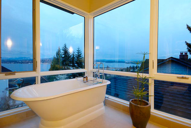 Mid-sized bathroom in Seattle with an undermount sink, flat-panel cabinets, white cabinets, quartzite benchtops, a freestanding tub, a one-piece toilet, beige tile, stone tile, beige walls, limestone floors and with a sauna.