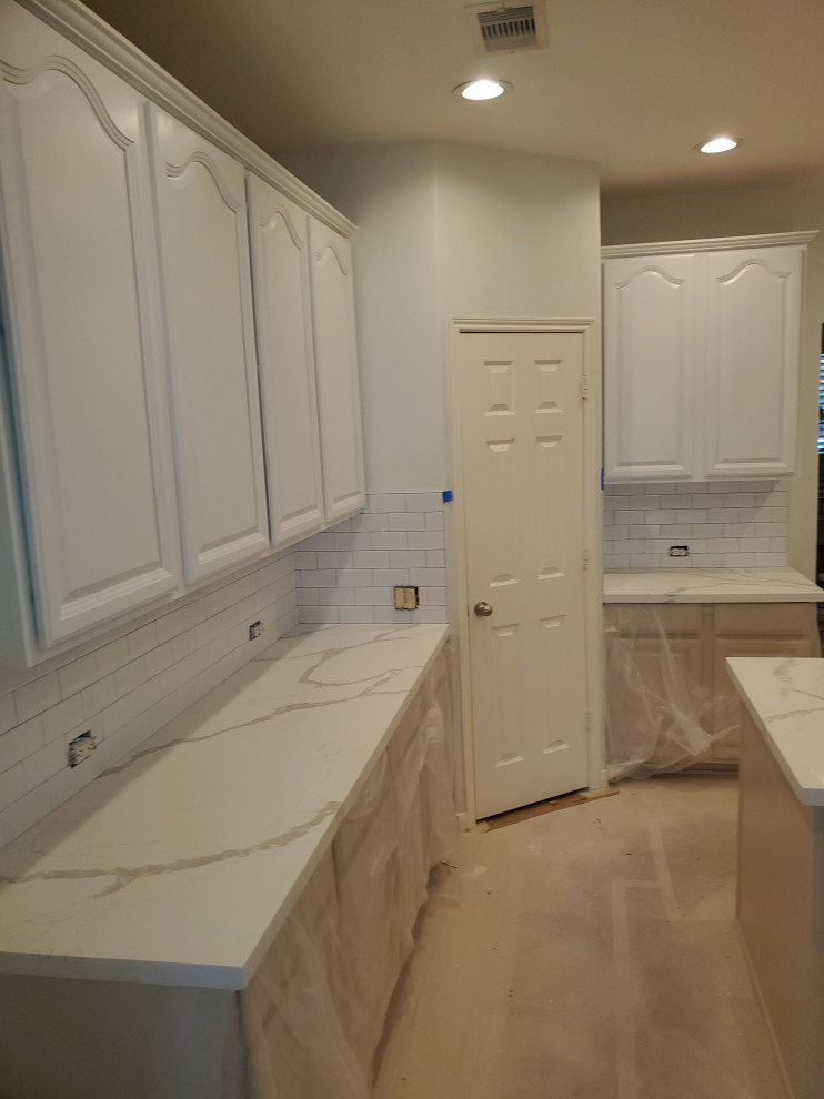 Example of a transitional laundry room design in Houston