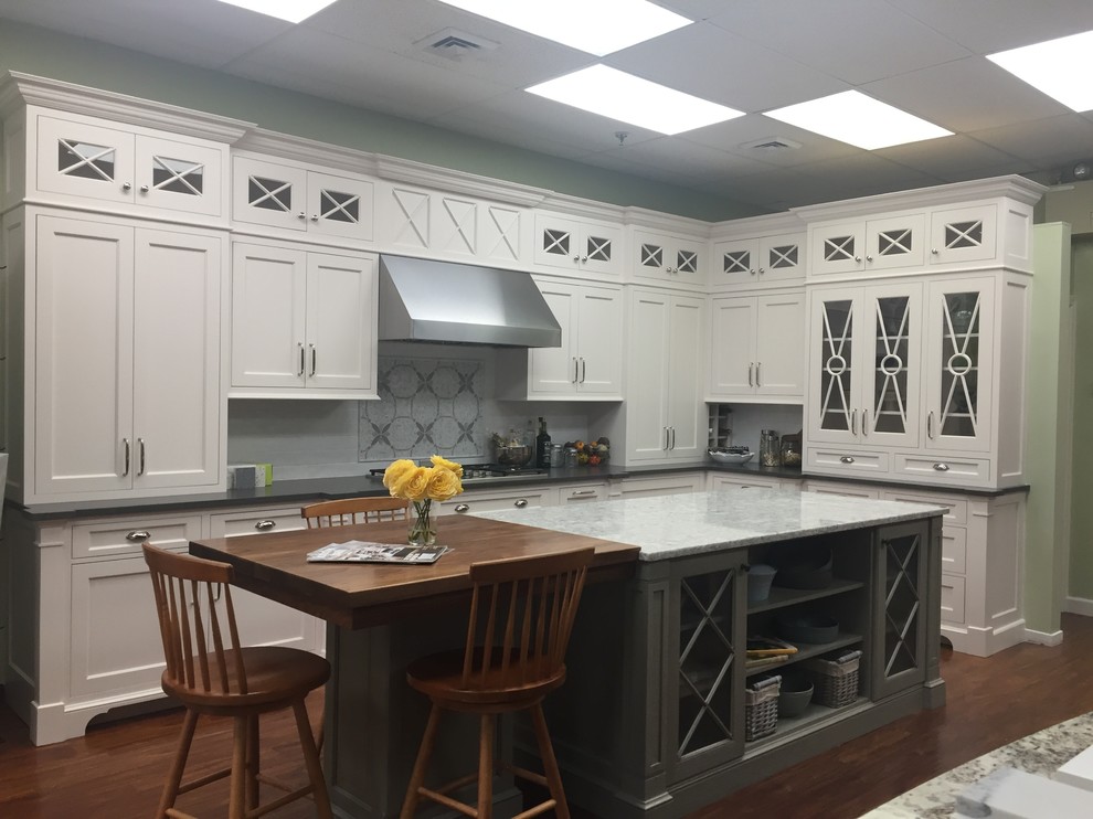 Inspiration for a transitional kitchen remodel in Boston with shaker cabinets, white cabinets, quartz countertops, white backsplash, subway tile backsplash and an island