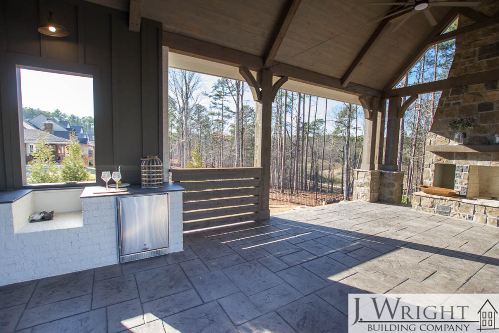 Design ideas for a large country backyard deck in Birmingham with an outdoor kitchen and a pergola.