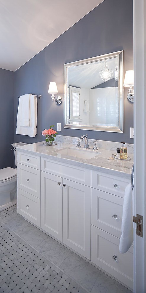 Inspiration for a mid-sized transitional master bathroom in San Francisco with an undermount sink, shaker cabinets, white cabinets, marble benchtops, an alcove tub, a shower/bathtub combo, a two-piece toilet, white tile, ceramic tile, blue walls and marble floors.