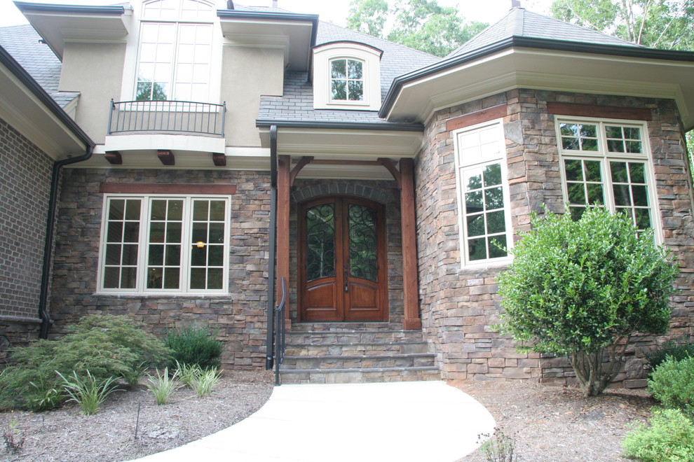 Mountain style home design photo in Raleigh